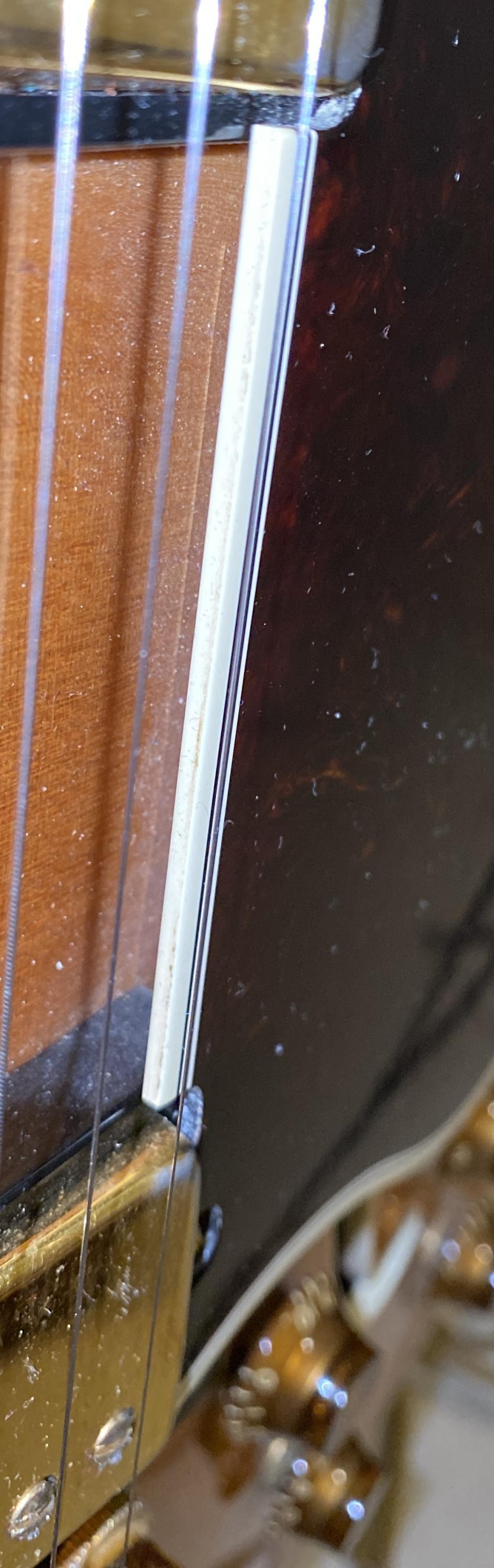 Guitar cracks or checks or damage - please help a clueless idiot-93e1bcaf-f62d-4615-8402-bb56ce0afa4d-jpg