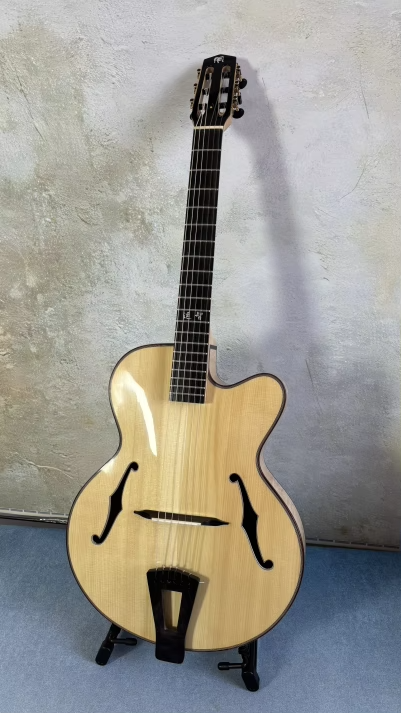 Does a nylon stringed archtop guitar exist?-alibabaf82f5a178cb81168f7d7348c51a9bc82_original-png