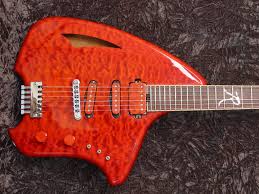 anyone here play any of those ergo guitar designs?-images-26-jpg