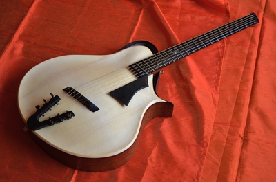 anyone here play any of those ergo guitar designs?-7978705-25731013-thumbnail-jpg