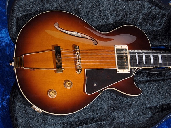 Small semi hollow shop body guitar