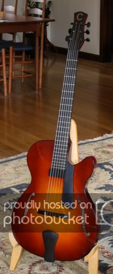 Can anyone recommend a light 15 guitar with a really warm tone-8bad8a42-dfcc-4531-93d0-c78289d47873-jpg