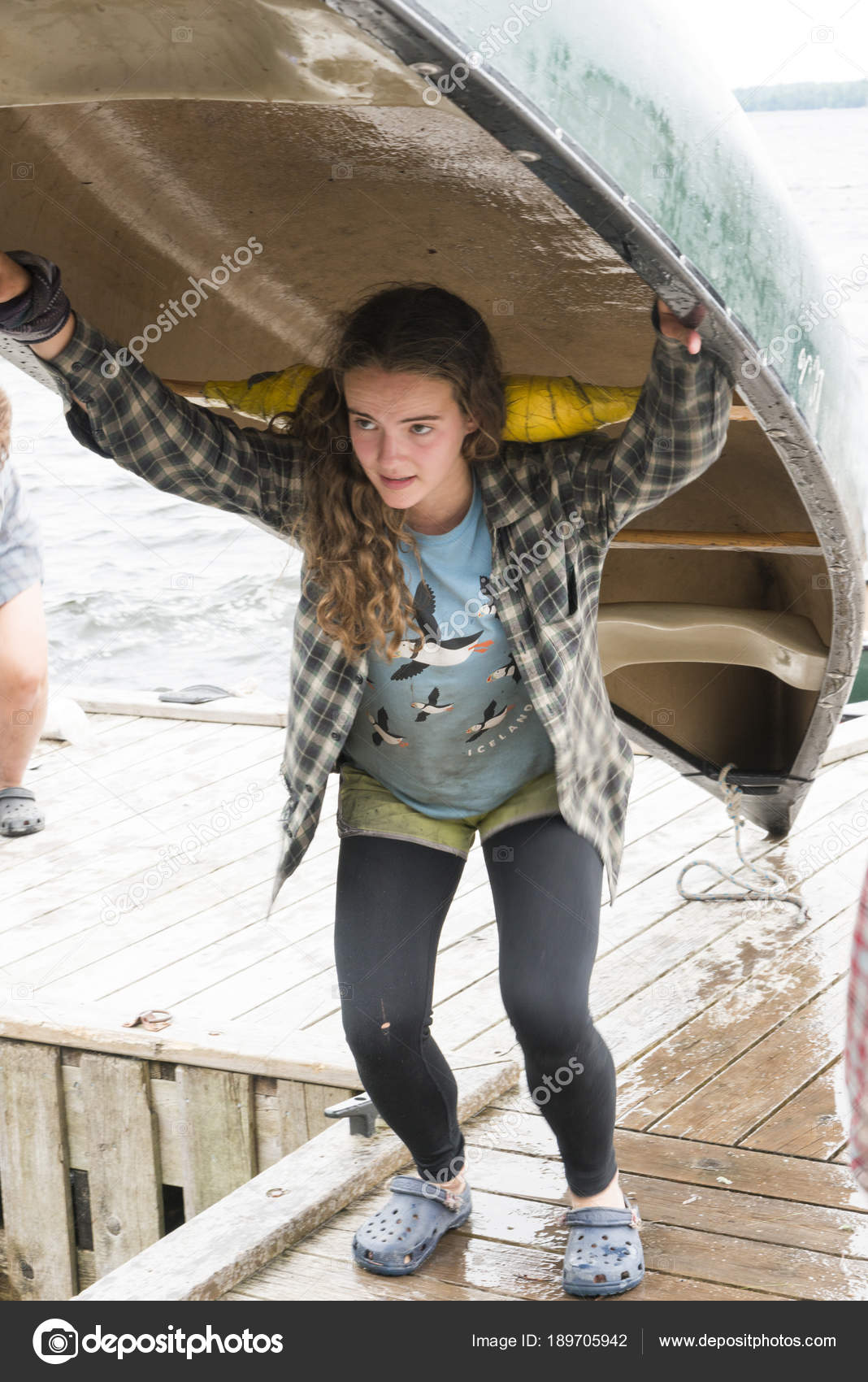 Buyer, seller, or holder?-teenage-girl-carrying-canoe-her-jpg