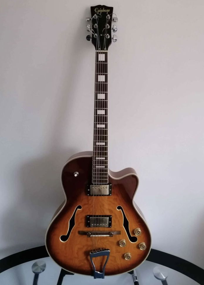 Possible Epi archtop with open book HS and Gibson font-952caeda-b3a5-4404-b94b-c58636352e1b-jpeg