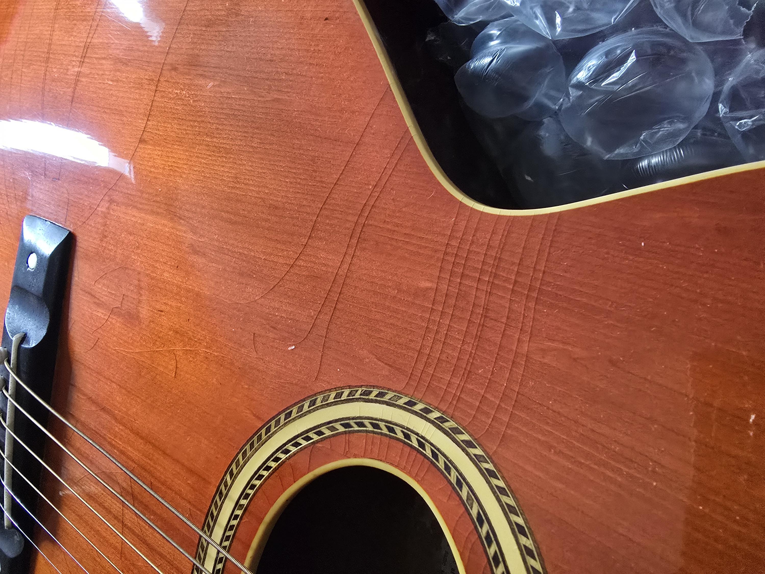 How much does checking on the top of a guitar impact the value?-20250125_113234-jpg