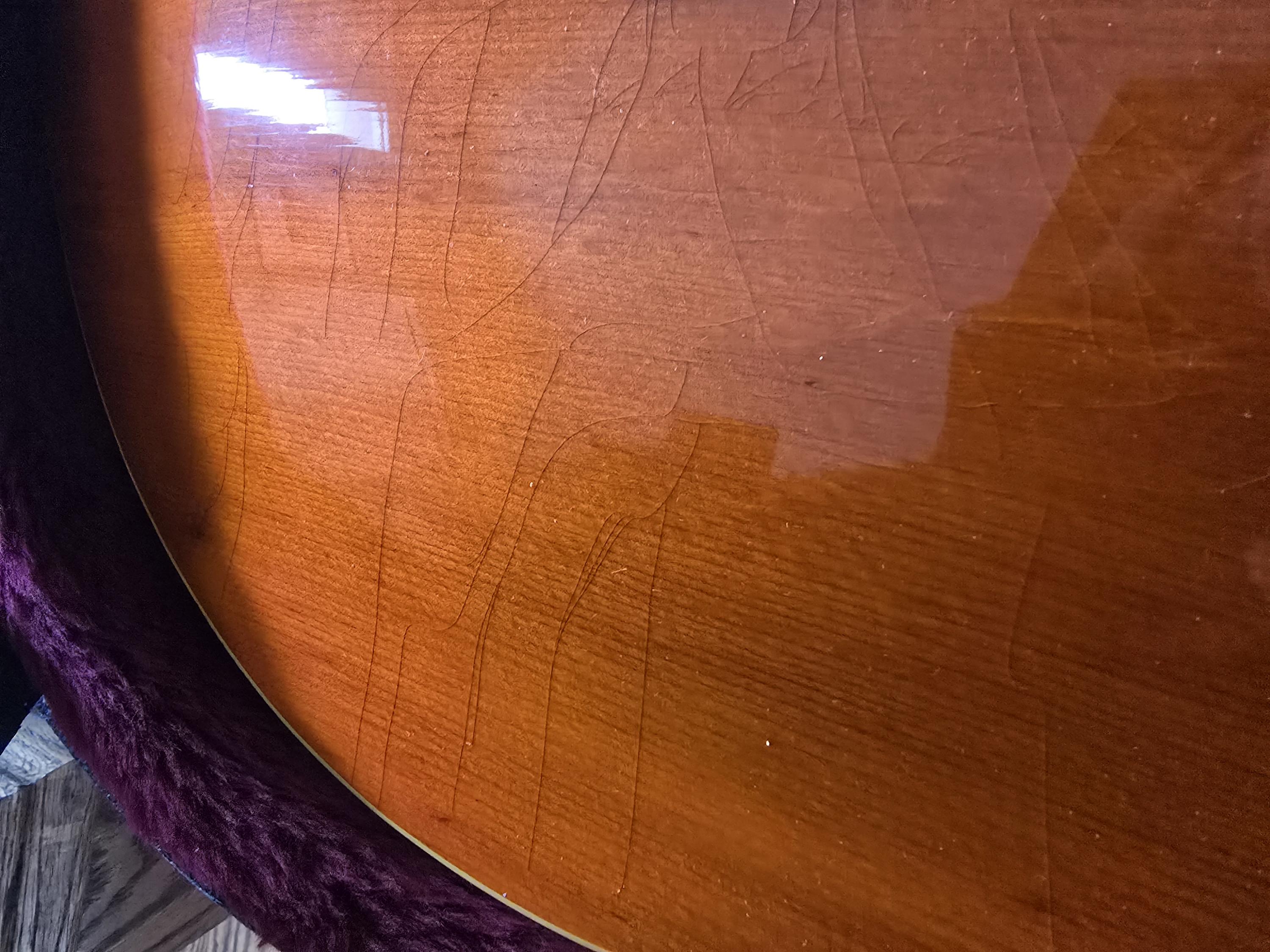 How much does checking on the top of a guitar impact the value?-20250125_113244-jpg