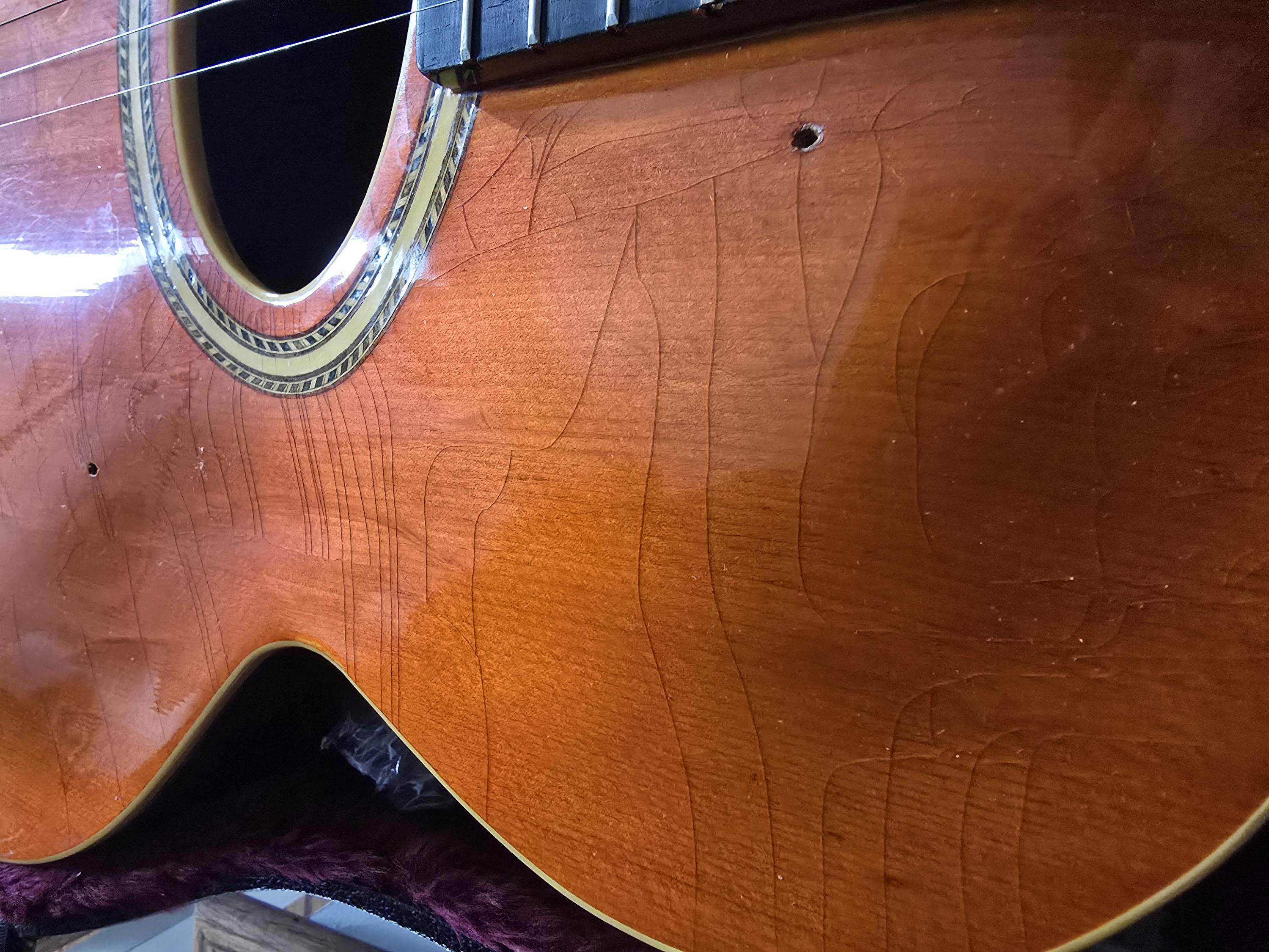 How much does checking on the top of a guitar impact the value?-20250125_113239-jpg