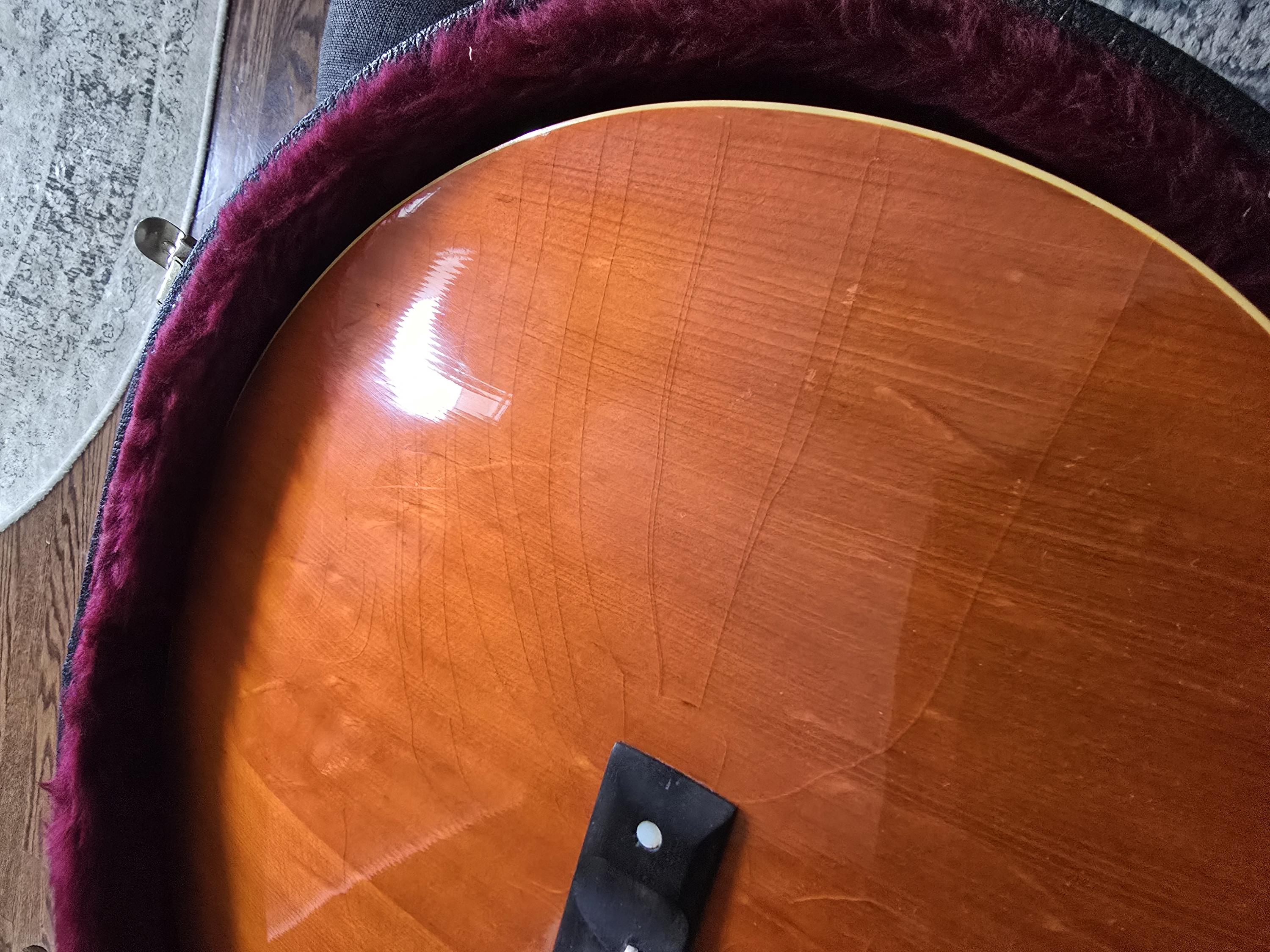 How much does checking on the top of a guitar impact the value?-20250125_113230-jpg