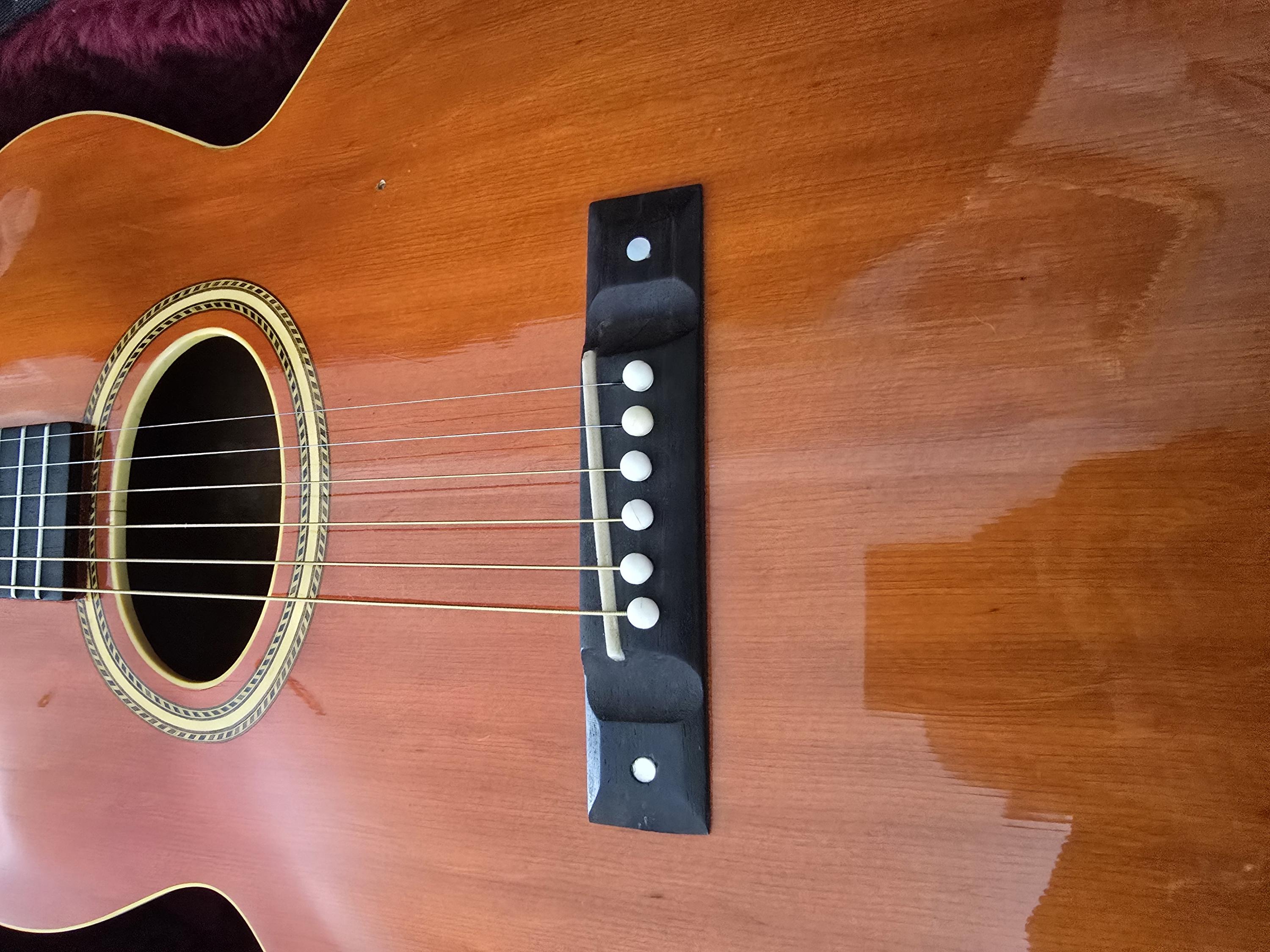 How much does checking on the top of a guitar impact the value?-20250111_124530-jpg